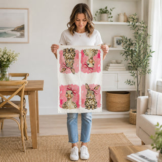 spring kitchen towel on cutting board
Easter towel styled in rustic kitchen
woman holding Easter kitchen towel
woman holding leopard bunny towel
woman holding spring goose towel
Easter kitchen towel being held
leopard Easter towel lifestyle image
pink bow Easter towel lifestyle photo
bunny and goose towel close up
leopard bunny kitchen towel close up
leopard goose tea towel close up
pink bow bunny towel detail
pink bow goose towel detail
Easter towel pink background close up
animal print Easter towel close 