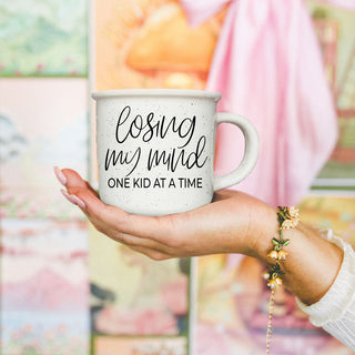 from kids to mom losing my mind coffee mug
gift from husband to wife funny mom mug
baby shower gift for second time mom mug
baby shower gift for third time mom funny mug
new mom gift losing my mind one kid at a time mug
gift set idea with coffee and mom humor mug
funny mom gift basket mug centerpiece