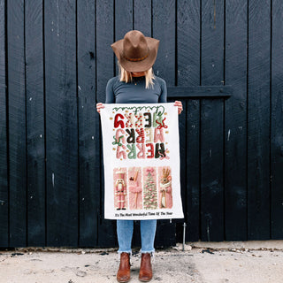 Add a soft, stylish touch to your holiday kitchen with this pink nutcracker Christmas kitchen towel. Featuring cozy knit-style “Merry Christmas” lettering and festive ballet-inspired designs, this decorative dish towel is perfect for holiday decor, hostess gifts, and seasonal kitchen styling.