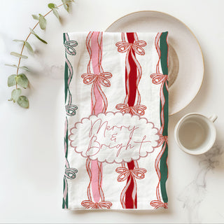 christmas kitchen towel with festive ribbon bow stripe pattern
merry and bright holiday dish towel pink red green ribbon design
holiday hand towel with bow print farmhouse christmas kitchen decor
festive christmas towel with vertical ribbon stripes and bows
pink holiday kitchen towel with bow accents and script lettering