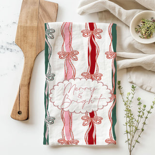 seasonal christmas cloth towel with bow motif and script text
holiday decorative towel with repeating ribbon stripe pattern
christmas themed kitchen cloth with bows and festive lettering
soft cotton christmas towel with bow stripe holiday design
cute christmas towel for stocking stuffer kitchen gift
holiday kitchen towel gift for hostess party favor idea