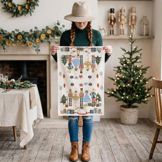 traditional holiday nutcracker kitchen accessory
festive kitchen towel with toy soldier and ballerina
nutcracker christmas theme tea towel home decor
classic holiday characters kitchen towel christmas style