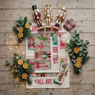 pink nutcracker christmas towel styled on rustic wood board with utensils
merry christmas pink towel with knit lettering close up detail
pink holiday kitchen towel aesthetic flat lay with neutral decor
nutcracker ballerina christmas towel styled for cozy kitchen scene