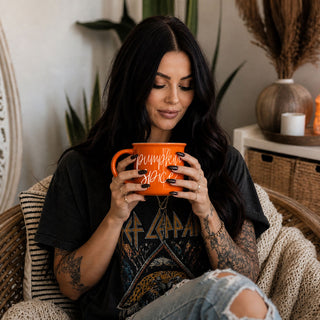 autumn lover coffee cup with pumpkin greeting
hello pumpkin mug with jeans and cozy cardigan
fall themed coffee mug in neutral boho bedroom
hello pumpkin mug close up of orange enamel style
pumpkin patch ready mug with hello pumpkin quote
hello pumpkin fall kitchen mug on countertop