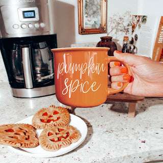 pumpkin spice latte mug and plaid scarf
wholesale pumpkin spice mug styled with fall decor
pumpkin spice autumn mug on couch with pillows
pumpkin spice latte cup with donut and coffee wholesalers usa 