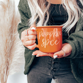 pumpkin spice fall mug with cozy socks
pumpkin spice mug on porch with mums and pumpkins
pumpkin spice latte mug next to pumpkin bread
pumpkin spice mug with acorns pinecones and leaves