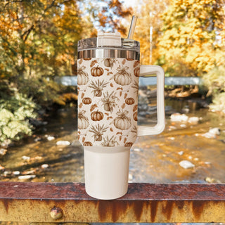 autumn coffee station tumbler
neutral warm toned coffee cup
pumpkin patch inspired tumbler
cute farmhouse pumpkin tumbler
fall tumbler with neutral pumpkins
cozy pumpkin tumbler with straw
autumn leaves and pumpkins aesthetic cup
neutral cream autumn tumbler