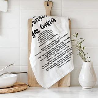 decorative baking towel christmas recipe print
christmas towel with recipe for homemade cookies
kitchen towel that shows gingerbread recipe steps
holiday dish towel with baking recipe design
recipe towel for christmas cookie baking decor