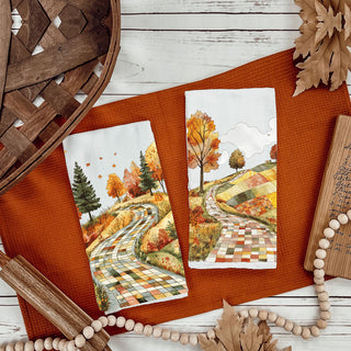 patchwork fall hillside towel for farmhouse coffee bar
neutral white towel with colorful autumn road print
autumn tree line road towel for seasonal kitchen styling
fall dish towel gift with scenic patchwork country road