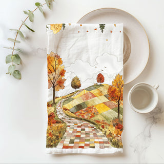 fall leaves and country road towel for seasonal decorating
autumn stroll dish towel with patchwork countryside
cozy fall kitchen towel with path through foliage
fall road and meadow towel for rustic dining room décor
autumn tree lined path towel for thanksgiving hostess gift