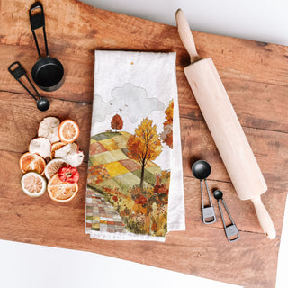 patchwork countryside tea towel for warm fall décor
fall baking towel with scenic road and pumpkins nearby
autumn hill and trees cotton towel for cozy entryway ladder
neutral white towel with watercolor autumn landscape print