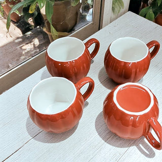 Rust Orange Pumpkin Mug with Cinnamon Sticks and Fall Leaves
Cozy Fall Morning with Pumpkin Shaped Coffee Cup