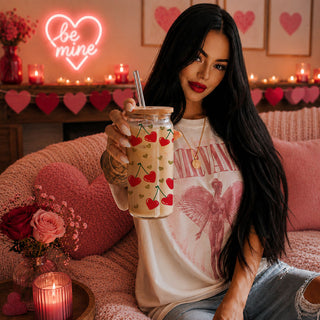 Wholesale 20oz glass cups with bamboo lid and glass straw featuring Self Love Club design, red heart, and cherry graphics.
Self Love Club 20oz glass cups with bamboo lid, glass straw, and gold glitter hearts for an empowering Valentine’s gift.
