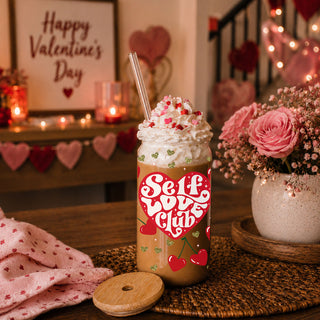 Wholesale 20oz glass cups with bamboo lid and glass straw featuring red hearts and gold glitter for self love gifts.
Women’s empowerment wholesale gifts with Self Love Club 20oz glass cups, bamboo lid, and glass straw.