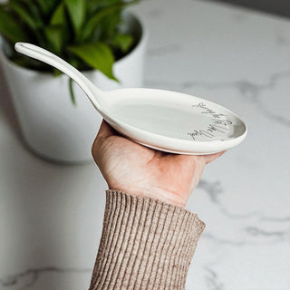 Detail view of spoon rest handle and raised edges
Funny kitchen decor gift set with spoon rest and utensils
Ready to gift cooking accessories set with humorous spoon rest