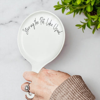 9-inch ceramic spoon rest with hand-lettered baking quote
Porcelain spoon rest with matching wooden spoon and gift ribbon
Standout kitchen gifts