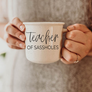 funny mug for special education teacher
unique teacher appreciation week gift mug
teacher of sassholes mug on white background
closeup of teacher of sassholes mug text
woman holding teacher of sassholes coffee mug
funny teacher mug for staff room wholesale