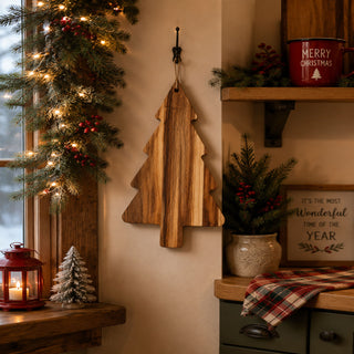 Christmas tree-shaped acacia cutting board hanging in a holiday kitchen
Wooden Christmas tree board hanging from its built-in display hole
Acacia wood cutting board displayed as Christmas kitchen décor
Hanging Christmas tree cutting board in a rustic farmhouse kitchen
Wooden holiday serving board hanging beneath a decorated kitchen shelf
Christmas tree board displayed on a wall with festive greenery
Decorative acacia wood tree board hanging in a Christmas kitchen