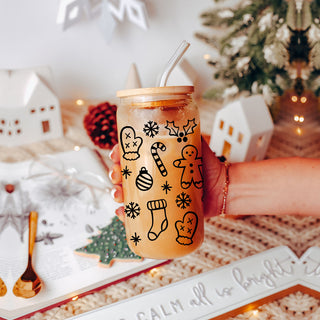 Glass cups with christmas graphics on it