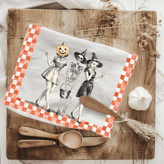 vintage style skeleton kitchen towel with pumpkin head friend
retro halloween flour sack towel with three ghoul squad girls
orange checkerboard halloween towel with vintage witch illustration
mid century style halloween dish towel pumpkin woman and skeleton