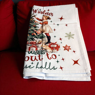 classic christmas dish towel with festive quote and tree
vintage style christmas towel with kids decorating tree
deck the halls towel with retro holiday theme