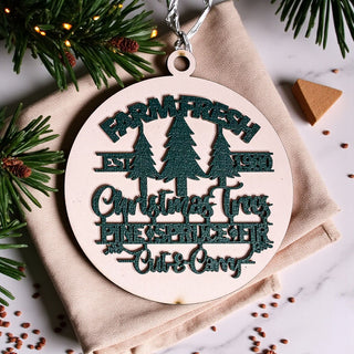 dimensional wooden Christmas ornament with trees
Farm Fresh Christmas Trees holiday tree decoration
wooden evergreen tree farm Christmas ornament
Christmas tree farm themed wooden decoration
rustic farmhouse tree ornament with wood lettering
round layered wood ornament for Christmas
decorative wooden Christmas tree farm keepsake